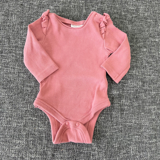 Girls Newborn Pink Ribbed Long Sleeved Bodysuit.