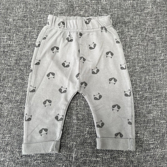 Unisex 0-3 Month Grey Joggers With A Raccoon Print.